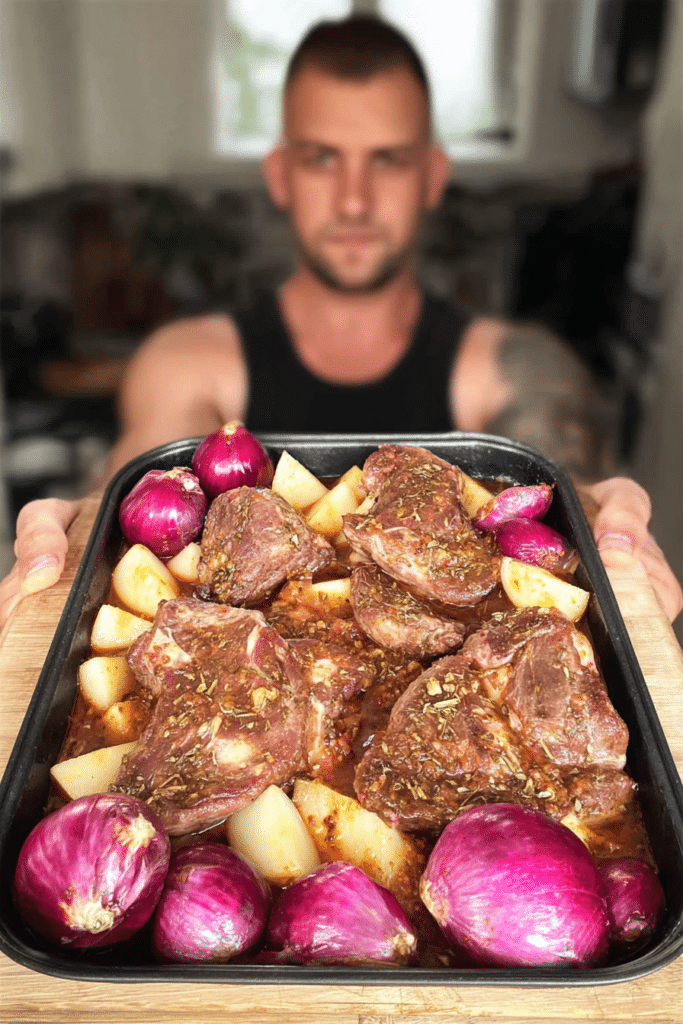 Delicious Cypriot Lamb Tava served with potatoes and garnished with herbs on a rustic table.