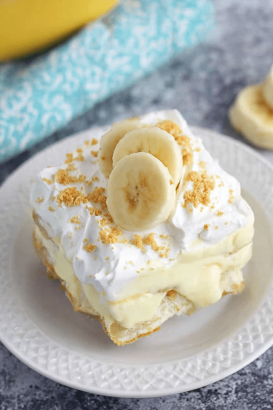 Close-up of a delicious no-bake banana pudding dessert layered with bananas and whipped topping