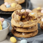 Delicious freshly baked Cadbury Egg Cookies with colorful Cadbury mini eggs around them.