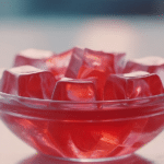 Vibrant Kelly Clarkson jello recipe served in a bowl with fresh fruit and mint garnish.
