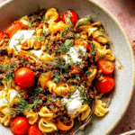 Vibrant bowl of viral Turkish pasta with creamy garlic yogurt and paprika butter drizzle.