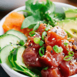 Delicious homemade ahi tuna poke bowl with fresh vegetables and brown rice