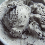 Delicious blueberry ice cream shaved ice topped with fresh blueberries and whipped cream