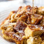 Close-up of a delicious French Toast Casserole topped with powdered sugar and cinnamon.