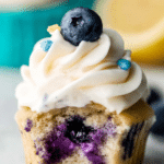 Delicious lemon blueberry cupcakes with cream cheese frosting, garnished with fresh blueberries and lemon slices.